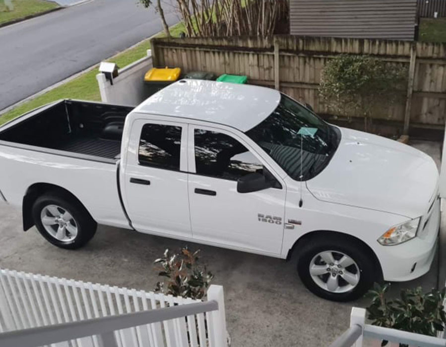 QG Auto's White Dodge Ram 1500 parked in a driveway in Brisbane.